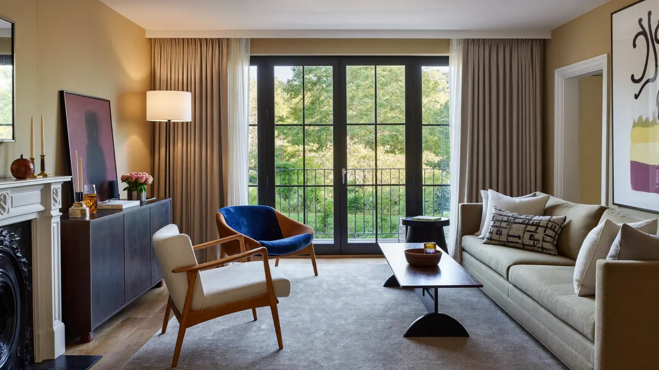 Bay window fronting a cosy carpeted living room in a UK house