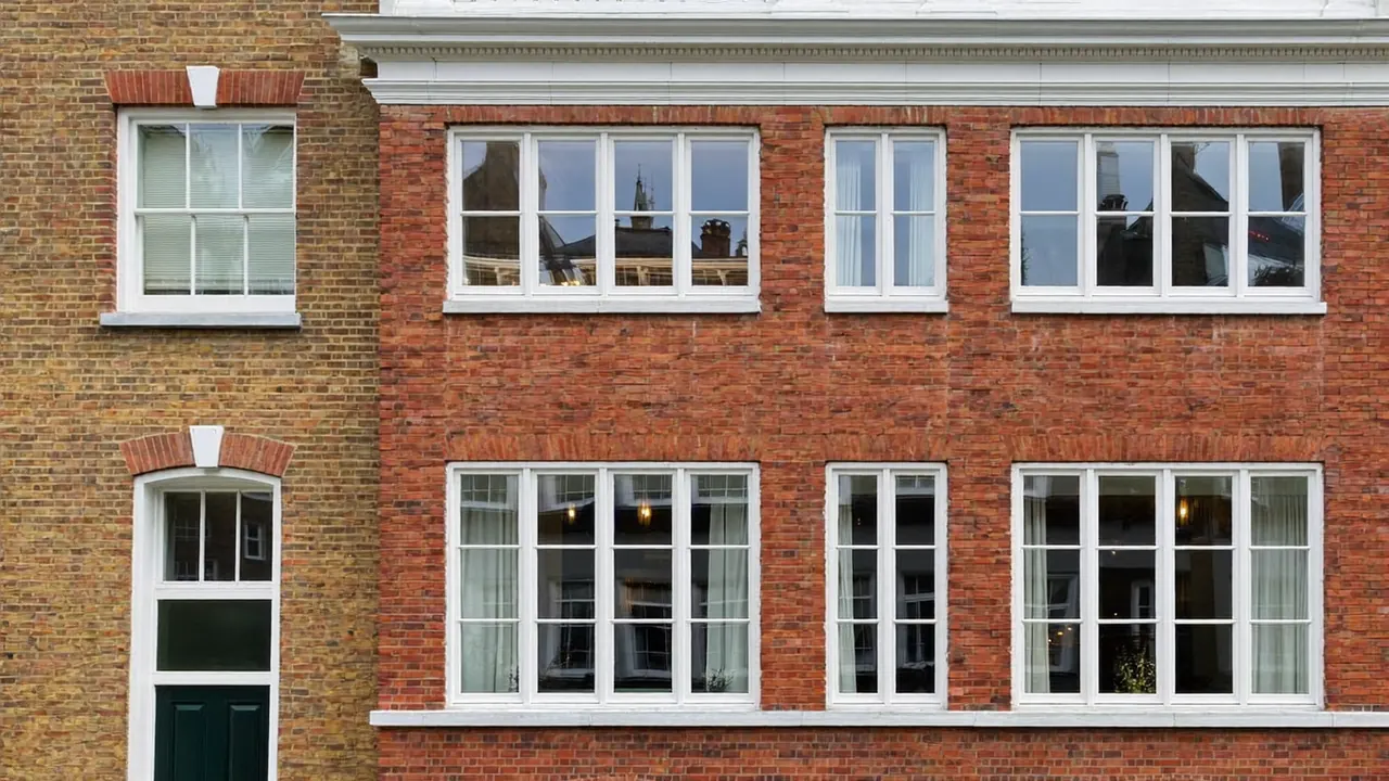 Lower sash of a sliding sash window pushed open to show the vertical slide