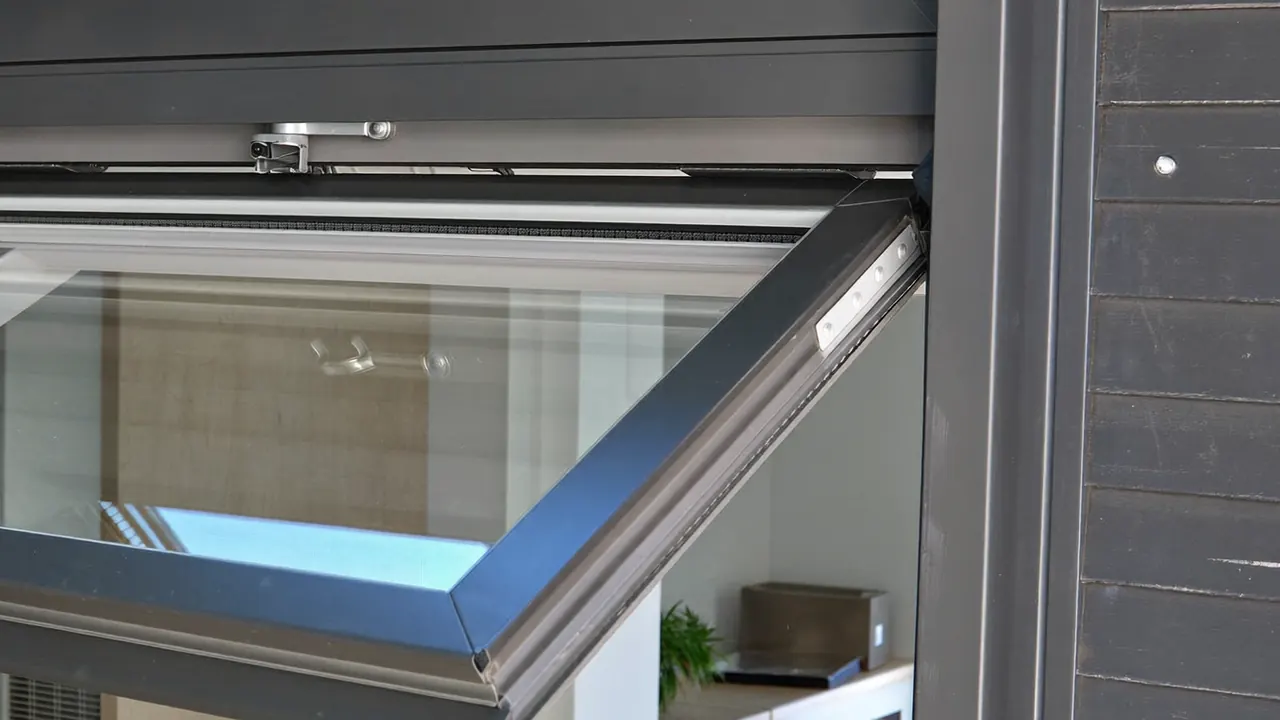 Tilt and turn window swung fully inwards into a bright modern room